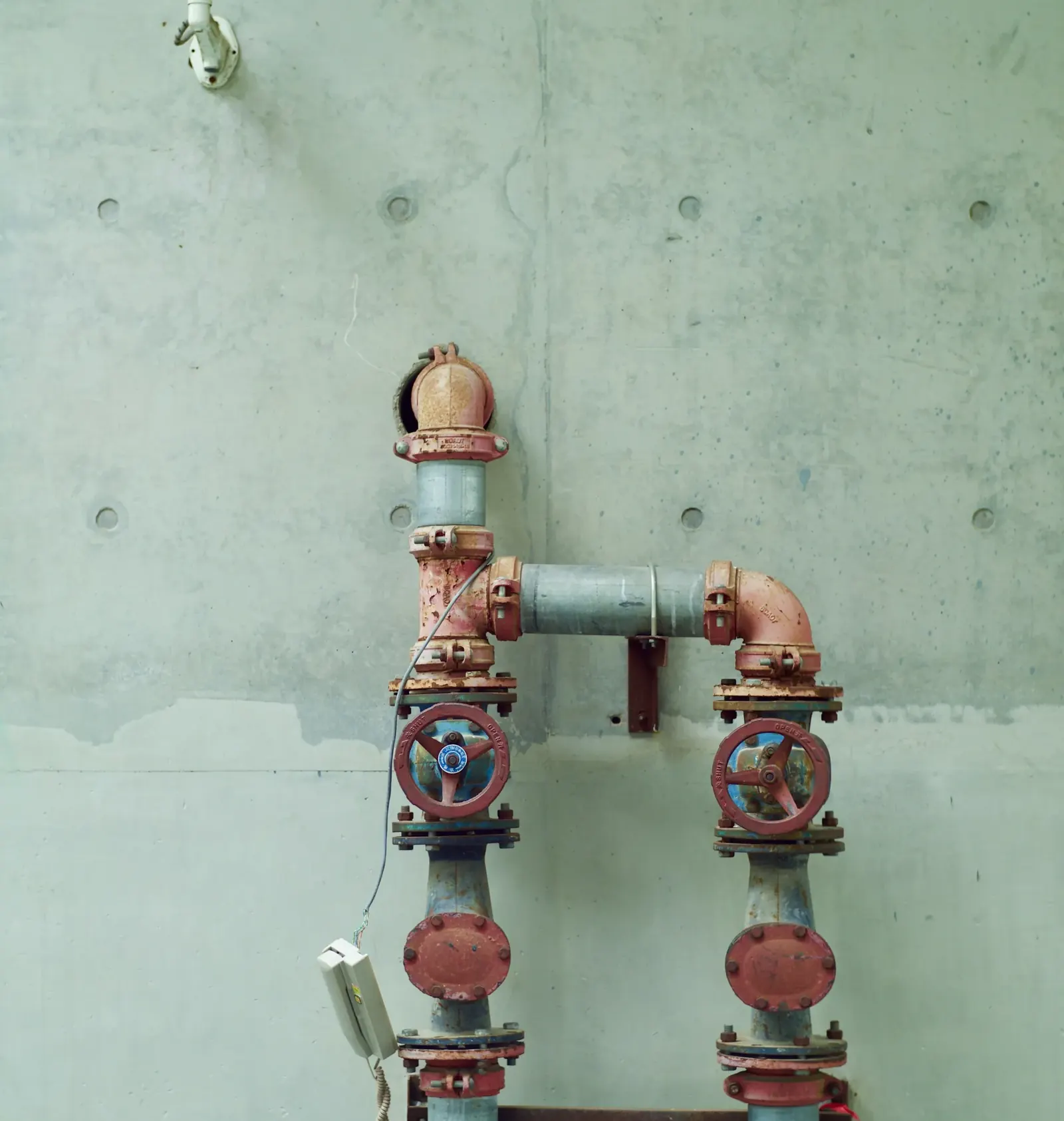Utility room piping with valves and pressure gauges